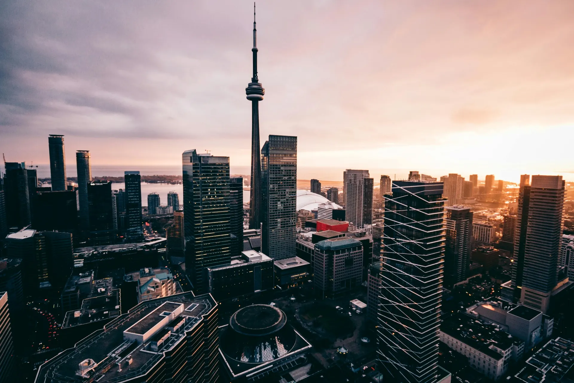 Toronto skyline at sunset featuring the CN Tower